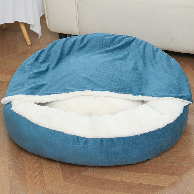 Dog burrowing under hooded orthopedic bed