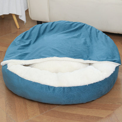 Dog burrowing under hooded orthopedic bed